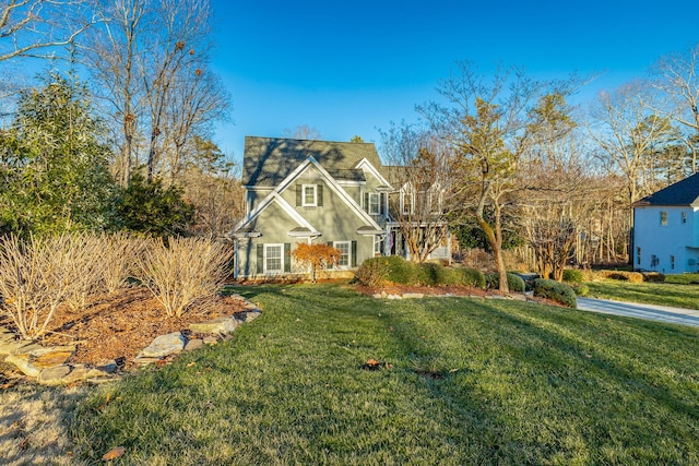 view of front of property with a front lawn