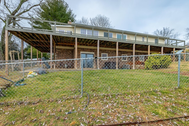 back of property featuring a lawn