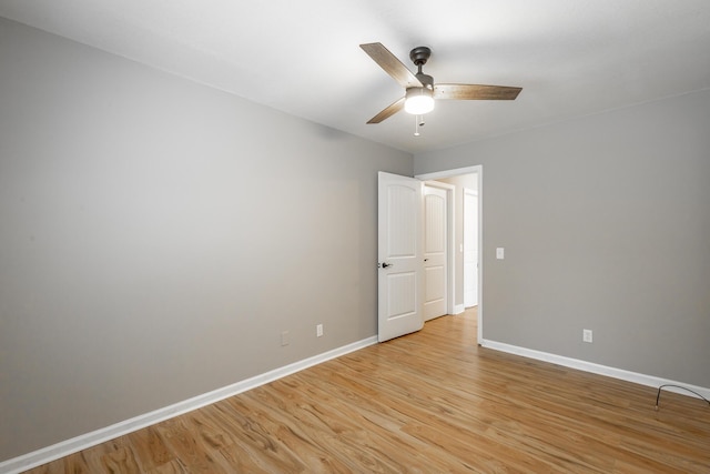 unfurnished room with ceiling fan and light hardwood / wood-style floors