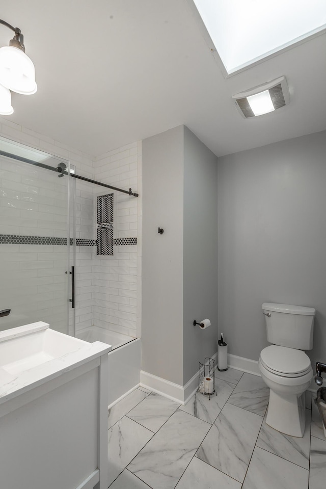 full bathroom with vanity, toilet, and tiled shower / bath combo