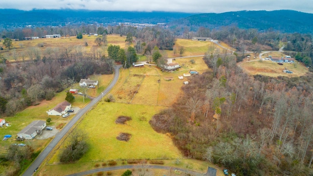 drone / aerial view with a mountain view and a rural view