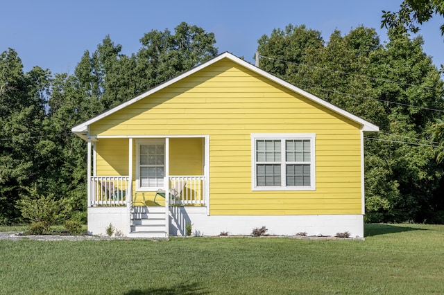 bungalow-style home featuring a front yard and a porch