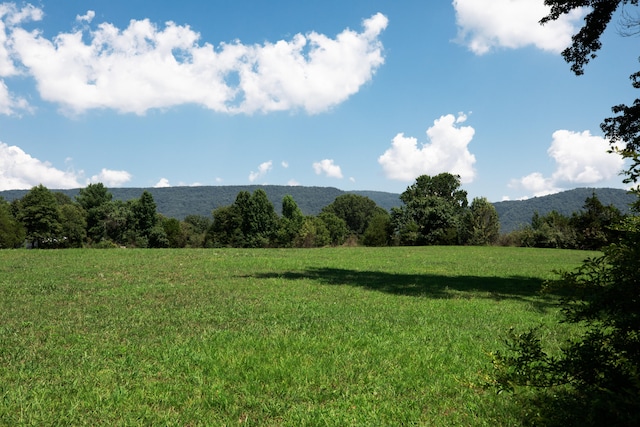 mountain view featuring a rural view