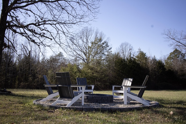 view of yard with an outdoor fire pit