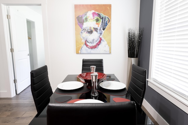 dining space with dark hardwood / wood-style floors