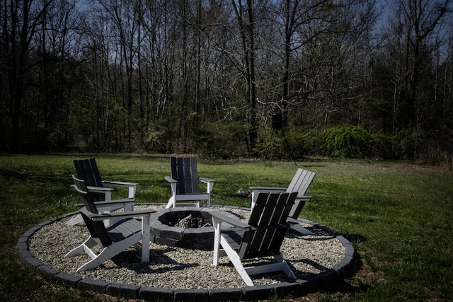 view of yard with an outdoor fire pit