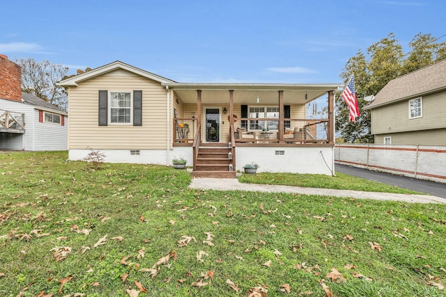 view of front facade featuring a front yard and a porch