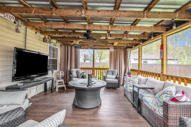 sunroom featuring ceiling fan