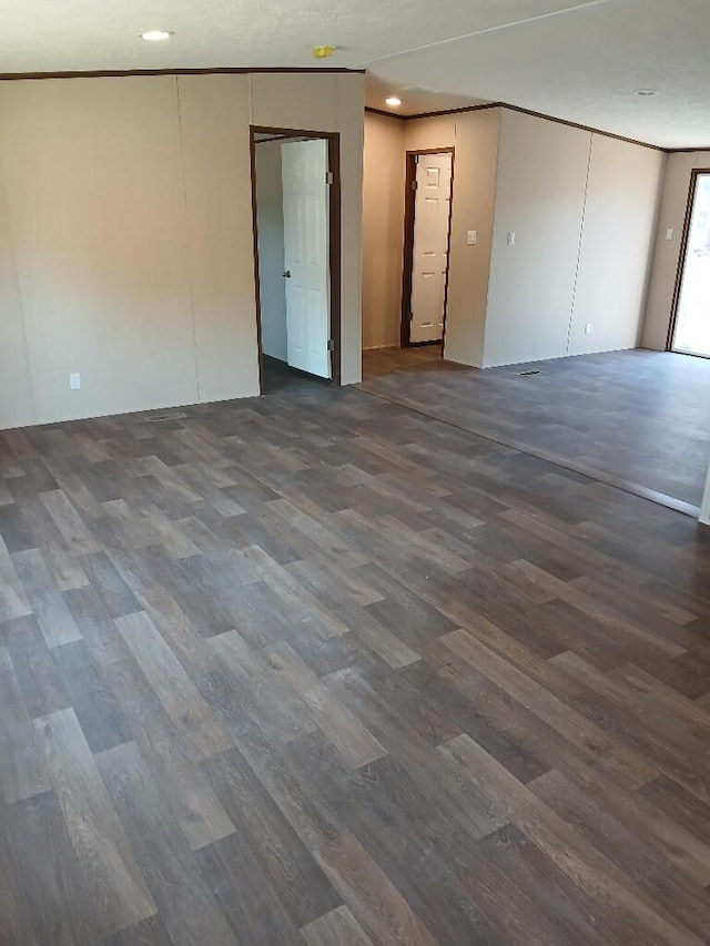 unfurnished room with dark hardwood / wood-style floors