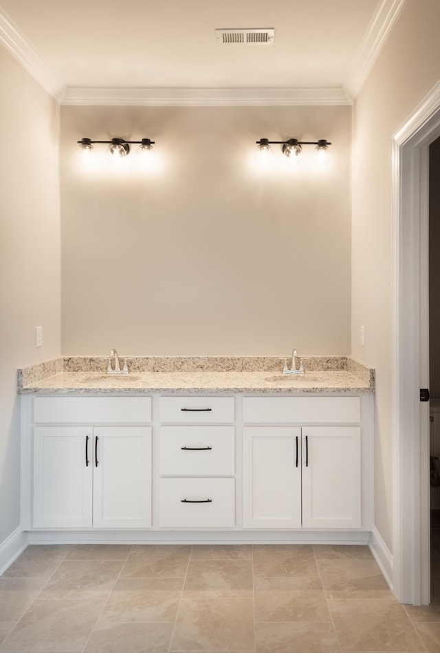 bathroom featuring ornamental molding, vanity, and tile patterned floors