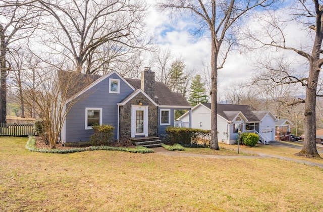 view of front facade with a garage and a front lawn