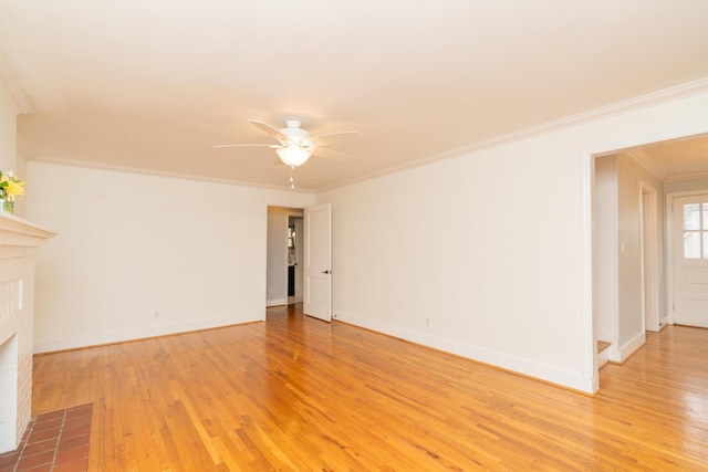 unfurnished living room with crown molding, ceiling fan, and light hardwood / wood-style flooring