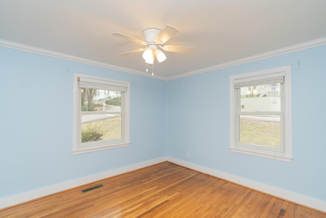 unfurnished room featuring hardwood / wood-style flooring, ornamental molding, and ceiling fan