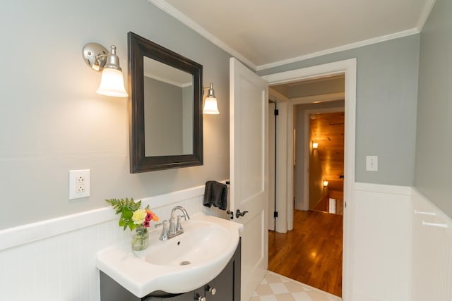 bathroom with crown molding and sink