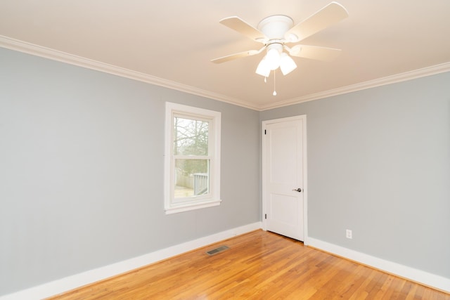 spare room with crown molding, ceiling fan, and light hardwood / wood-style flooring