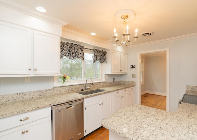 kitchen with dishwasher, sink, white cabinets, hanging light fixtures, and crown molding