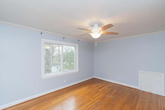 spare room with wood-type flooring, ornamental molding, and ceiling fan