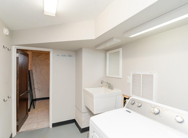 laundry room featuring washer / dryer and sink