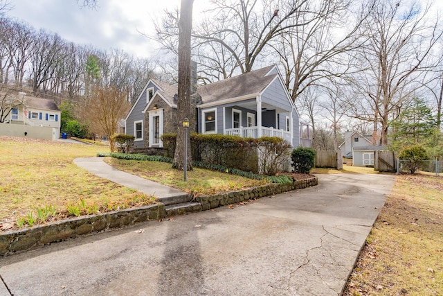 view of front of house featuring a front yard and a porch