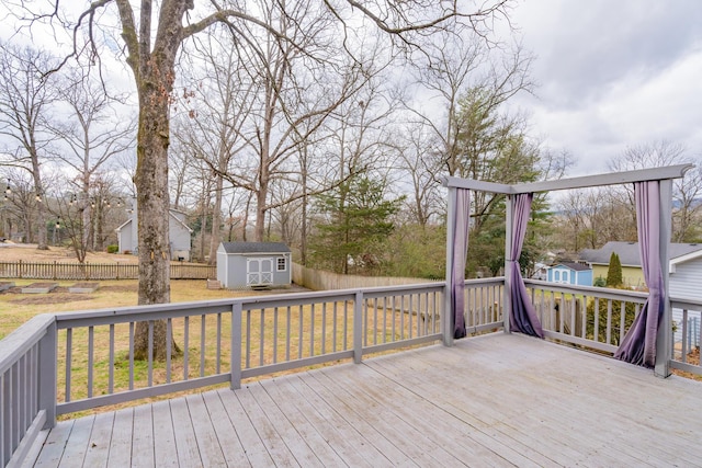 wooden deck featuring a storage shed