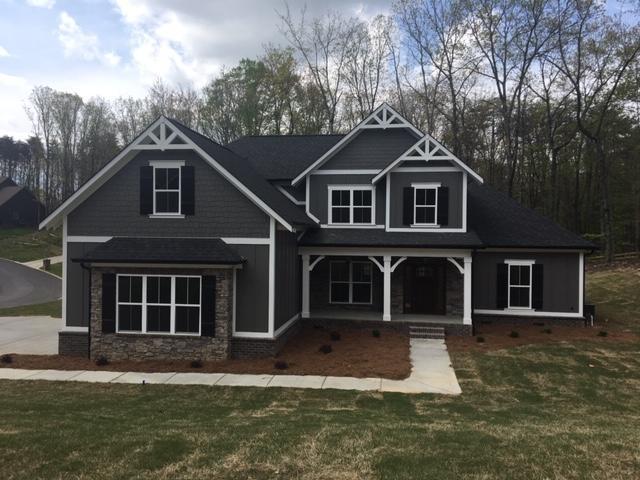 craftsman-style home with a front yard