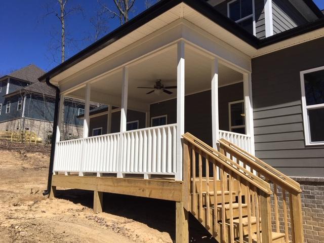 wooden deck featuring ceiling fan