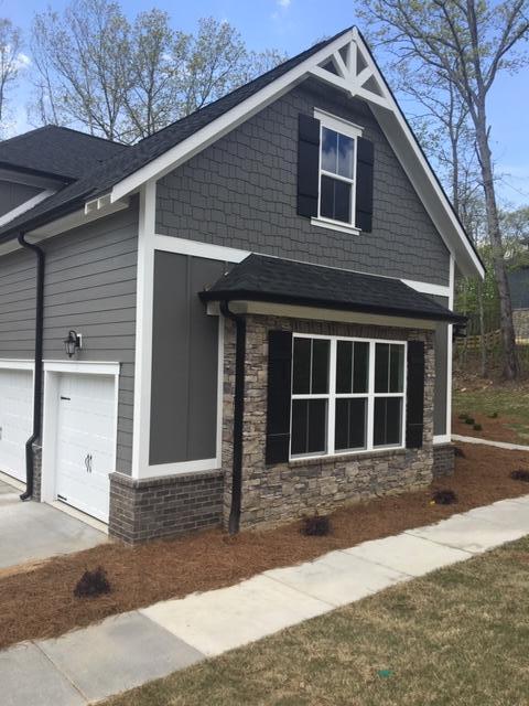 view of side of property with a garage