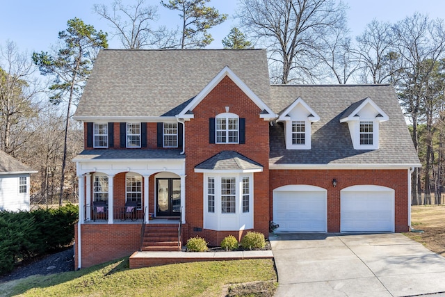 view of front of property with a garage and a porch