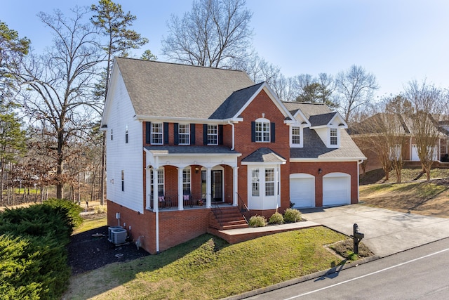 colonial house featuring a porch, central AC, a garage, and a front yard