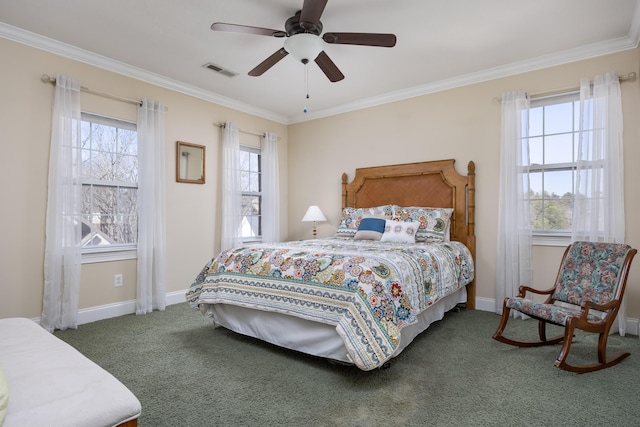 carpeted bedroom with ornamental molding and ceiling fan