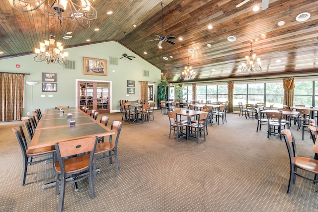 carpeted dining area with a healthy amount of sunlight, wood ceiling, high vaulted ceiling, and french doors