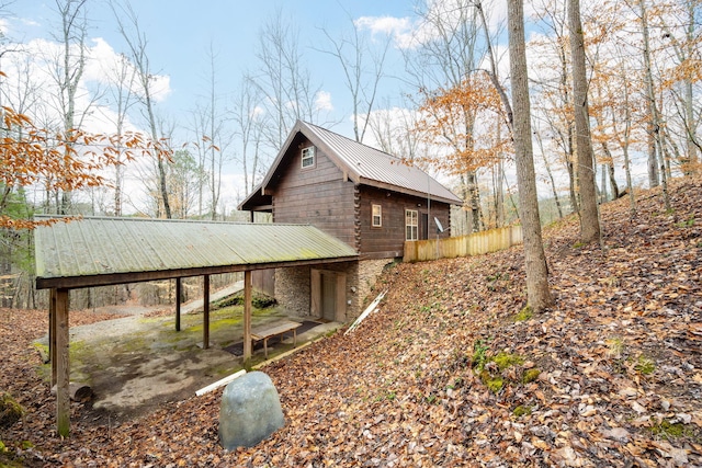 view of property exterior with a water view