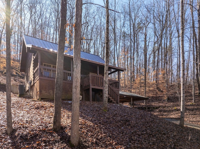 back of property featuring a wooden deck and central AC unit