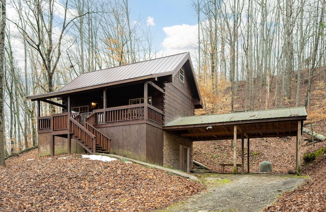 view of side of property with a porch