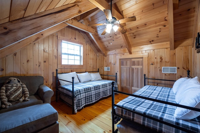 bedroom featuring light wood-type flooring, lofted ceiling with beams, wooden ceiling, and wood walls