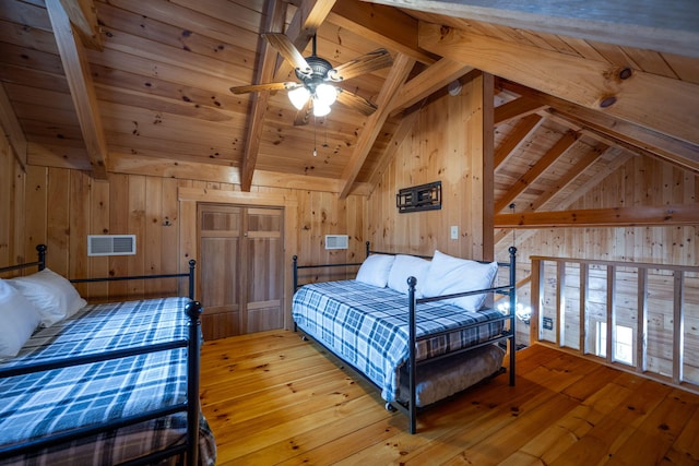 bedroom featuring vaulted ceiling with beams, wooden ceiling, light wood-type flooring, and wood walls