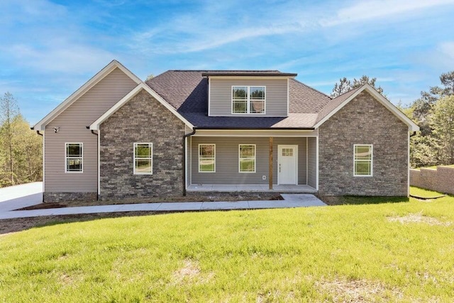 view of front of property featuring covered porch and a front yard