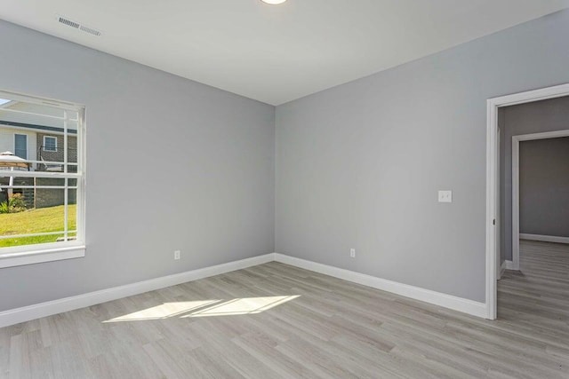 spare room featuring light wood-type flooring