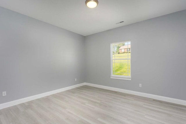 spare room featuring light hardwood / wood-style flooring