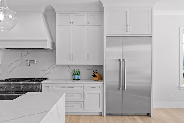 kitchen with white cabinetry and premium appliances