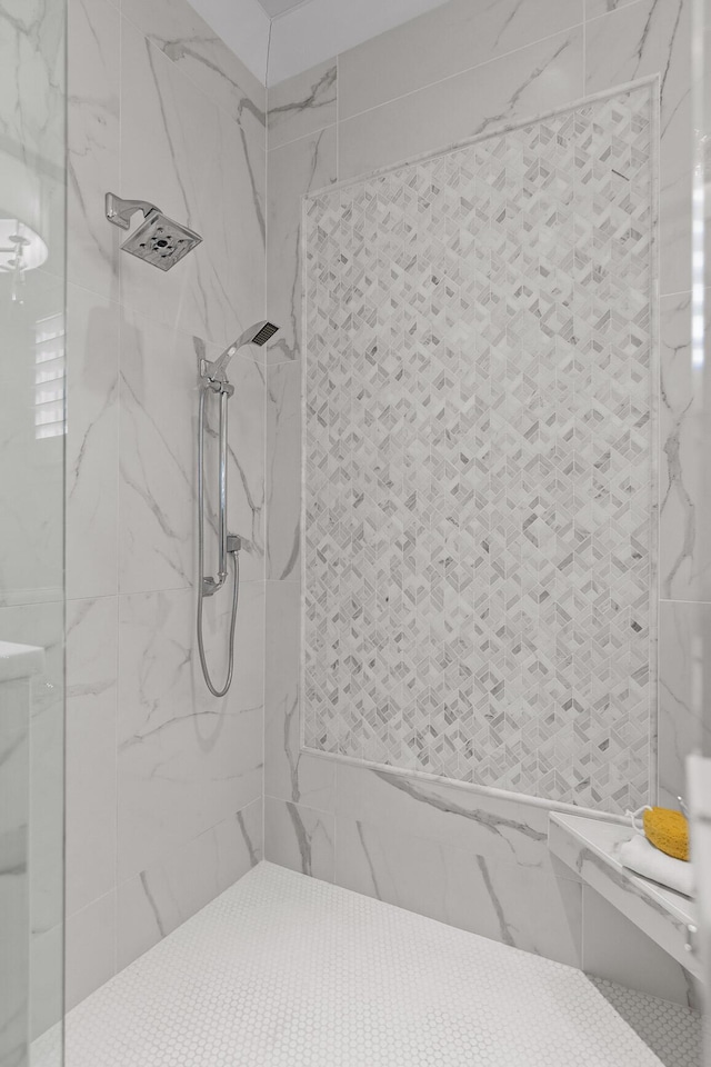 bathroom featuring tiled shower