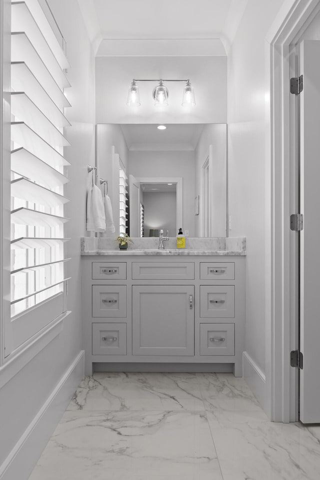 bathroom featuring vanity and ornamental molding