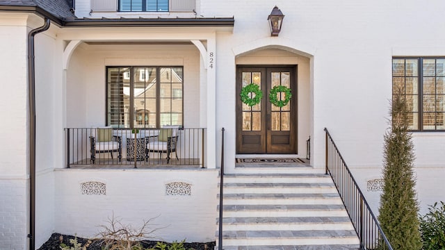 doorway to property featuring french doors