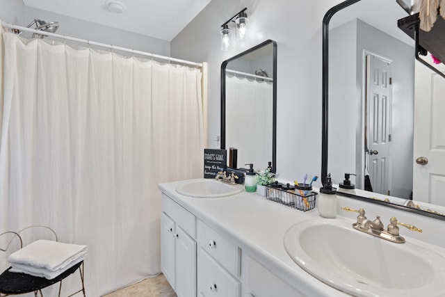 bathroom featuring tile patterned flooring and vanity