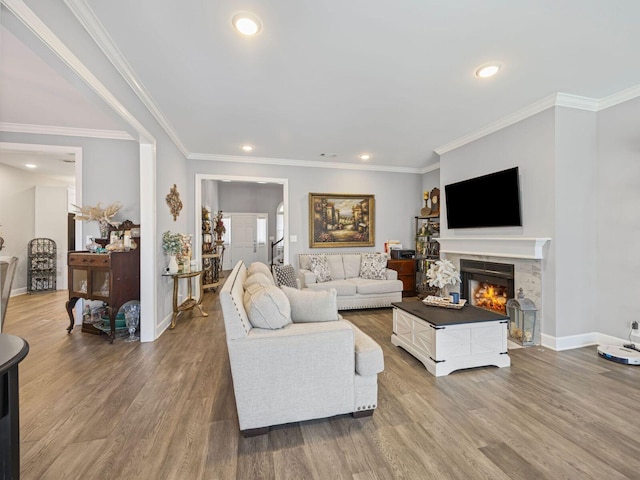 living room with hardwood / wood-style floors and ornamental molding