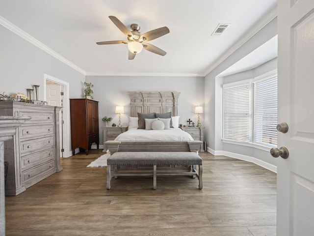 bedroom featuring wood-type flooring, ornamental molding, and ceiling fan