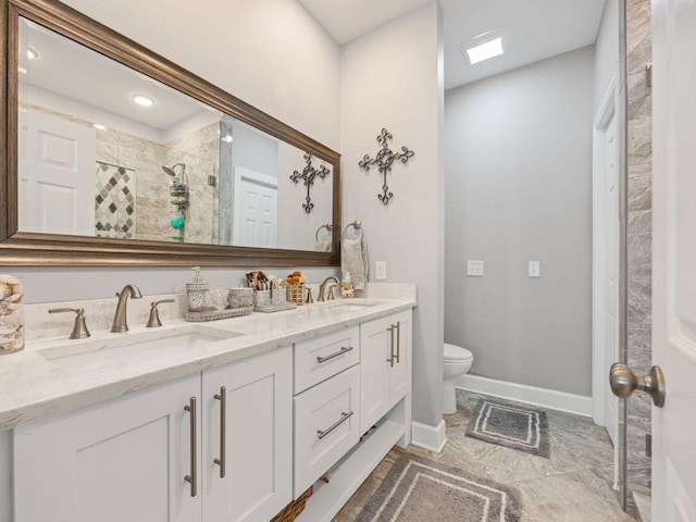 bathroom featuring vanity, an enclosed shower, and toilet