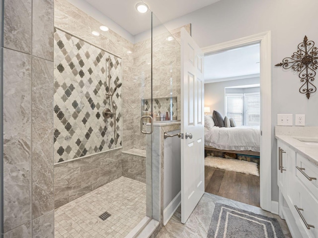 bathroom featuring vanity, ornamental molding, and walk in shower