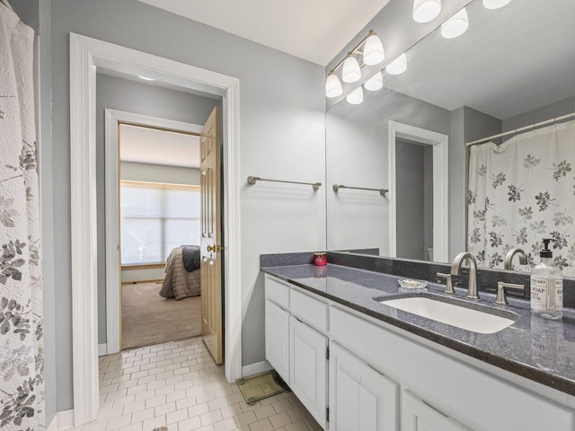 bathroom with vanity and tile patterned floors