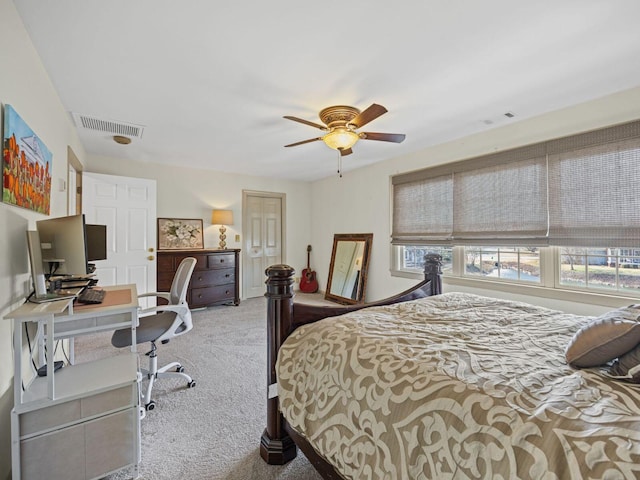 bedroom featuring light colored carpet and ceiling fan